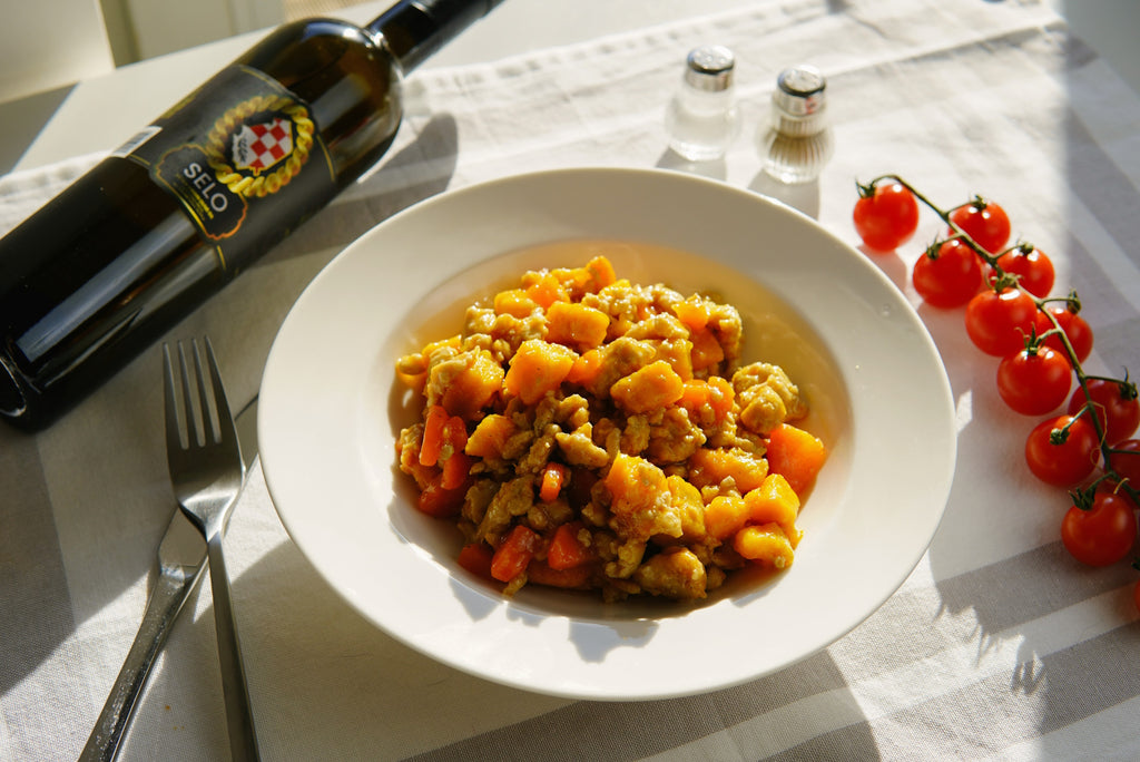 A warming pot of Winter Tuber and Ground Beef Stew (Zimska Juha od Krumpira i Mljevenog Mesa), enhanced with a splash of Croatian olive oil for a delicious and satisfying meal.
